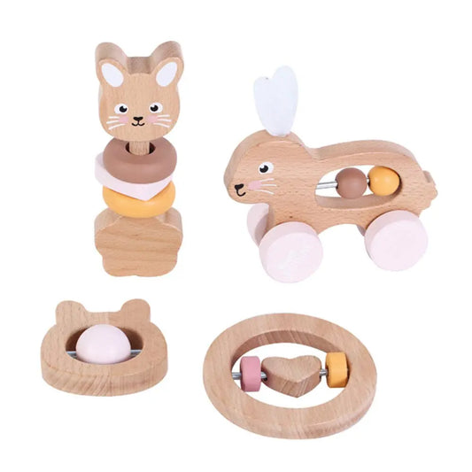 Set of wooden toys for infants on a white background