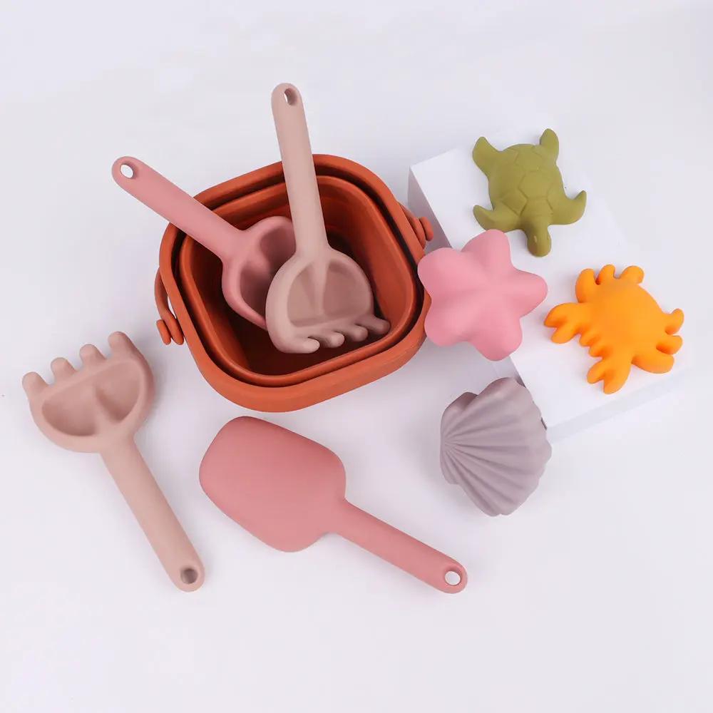 BPA-free silicone bucket with spade and rake, perfect for digging and scooping fun