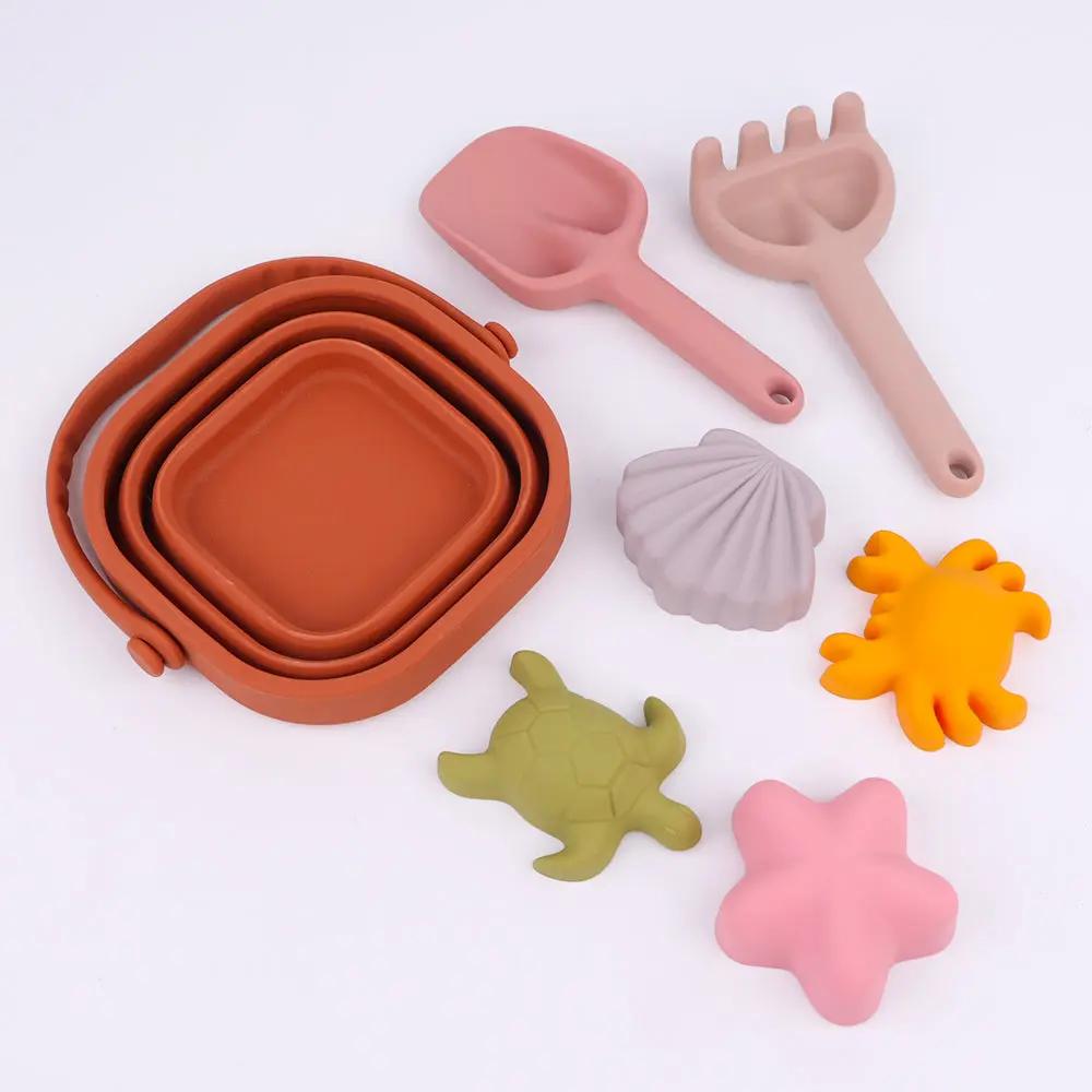 Beach essentials for toddlers – silicone bucket, spade, rake, and fun sea creature moulds