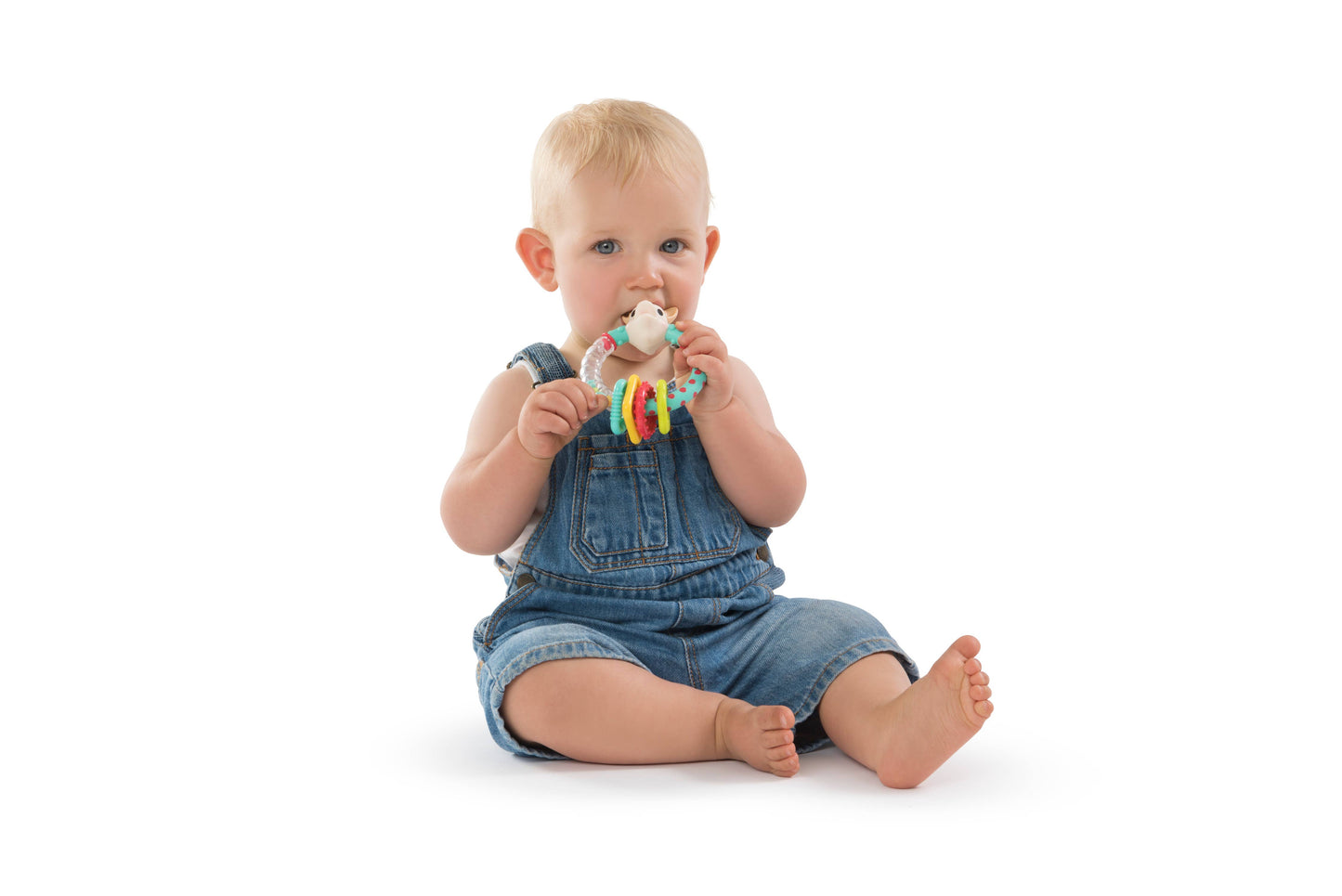 Baby chewing on Sophie the Giraffe teething ring
