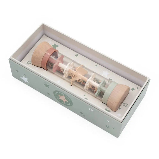 Rain maker toy inside a decorative box on a white background