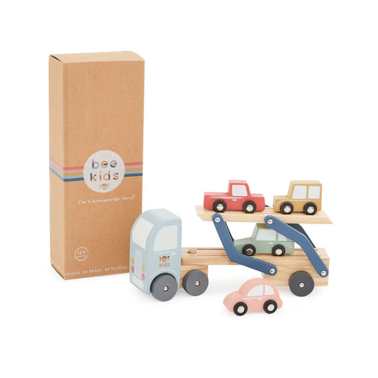 Wooden toy car carrier with cars and packaging on a white background