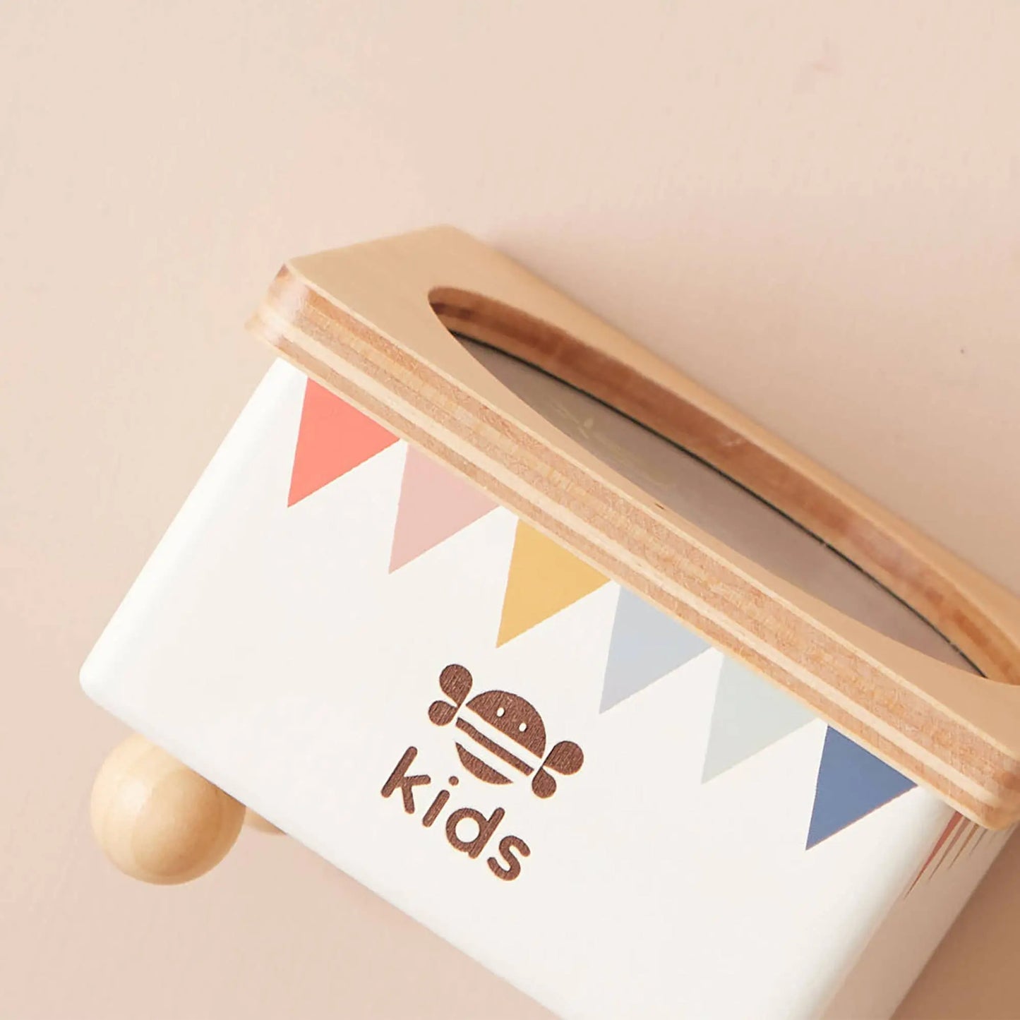 A detailed look at the rainbow bunting design and whimsical water-themed artwork.