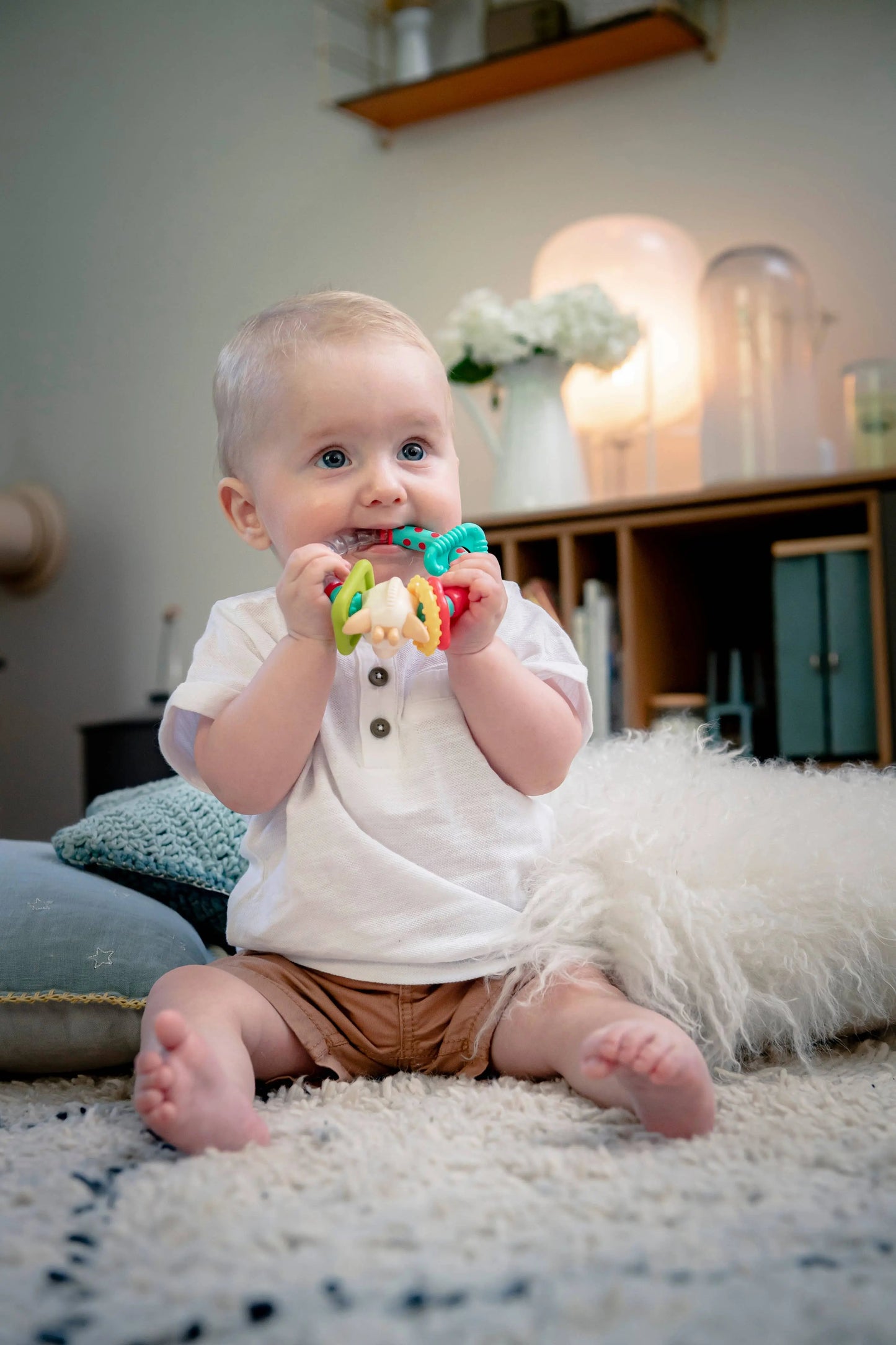 Sophie the Giraffe teething rattle with bright colours and shapes