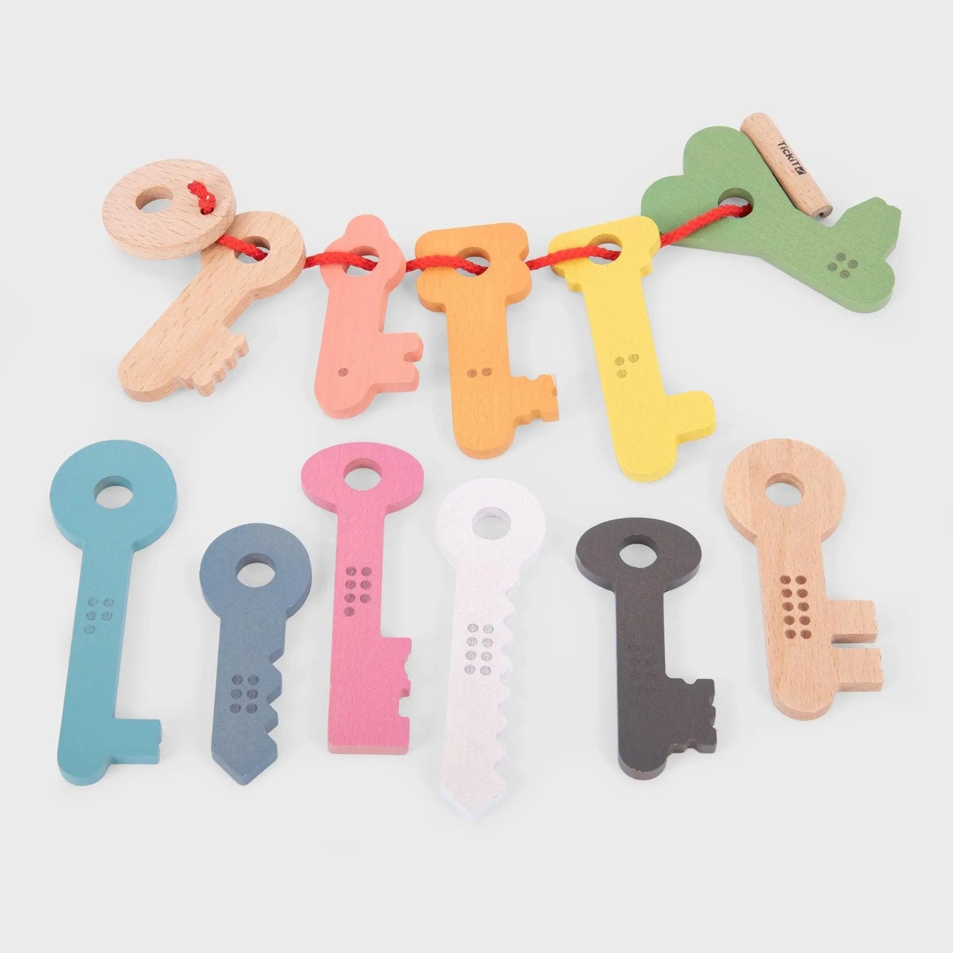 Colourful key-shaped toys on a white background