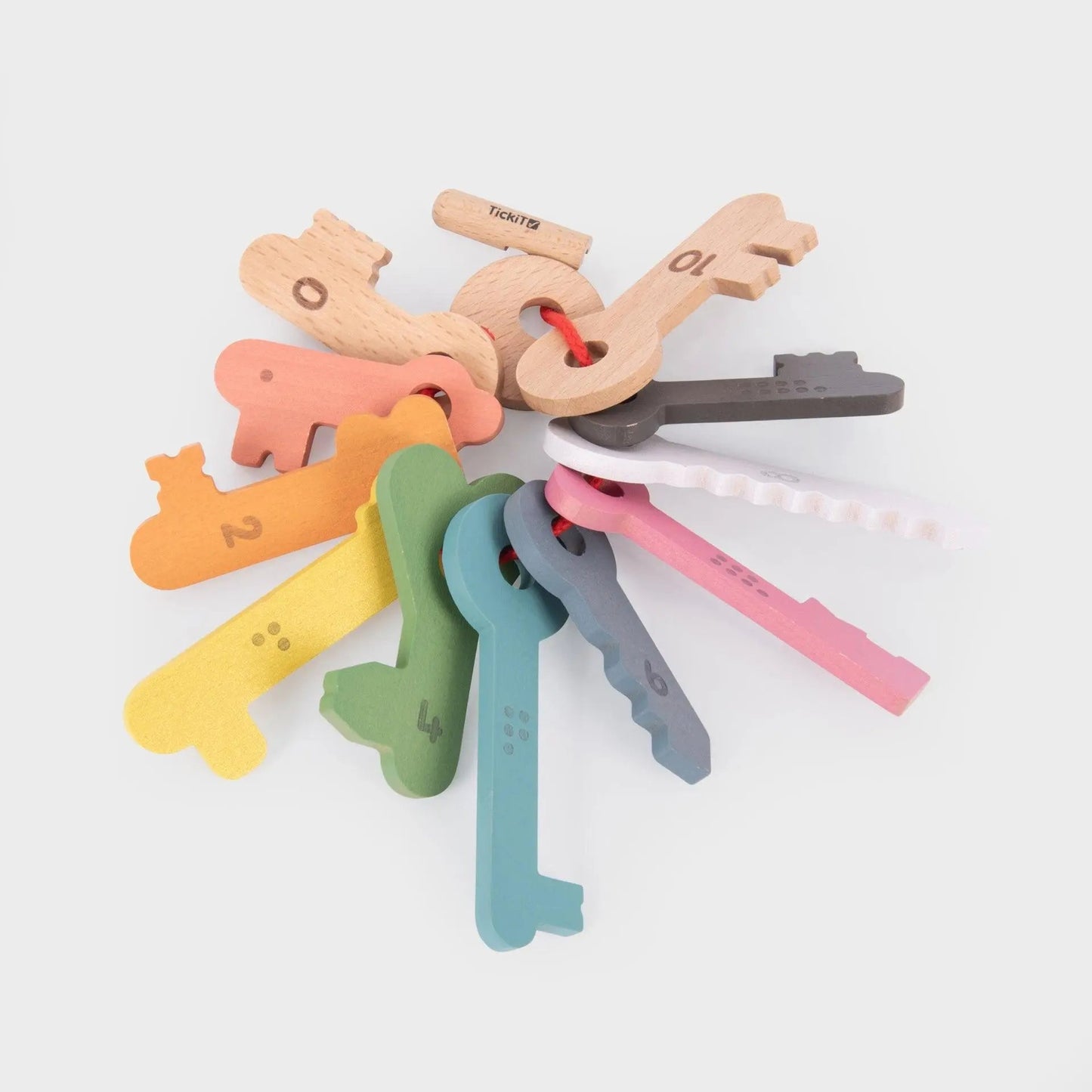 Colourful wooden keys on a white background