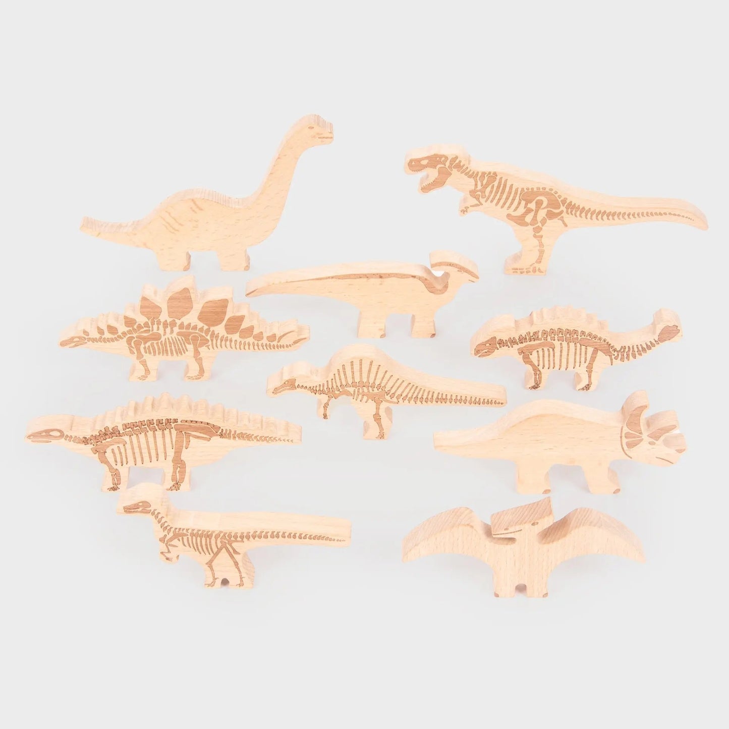 Set of dinosaur toys on a light grey background