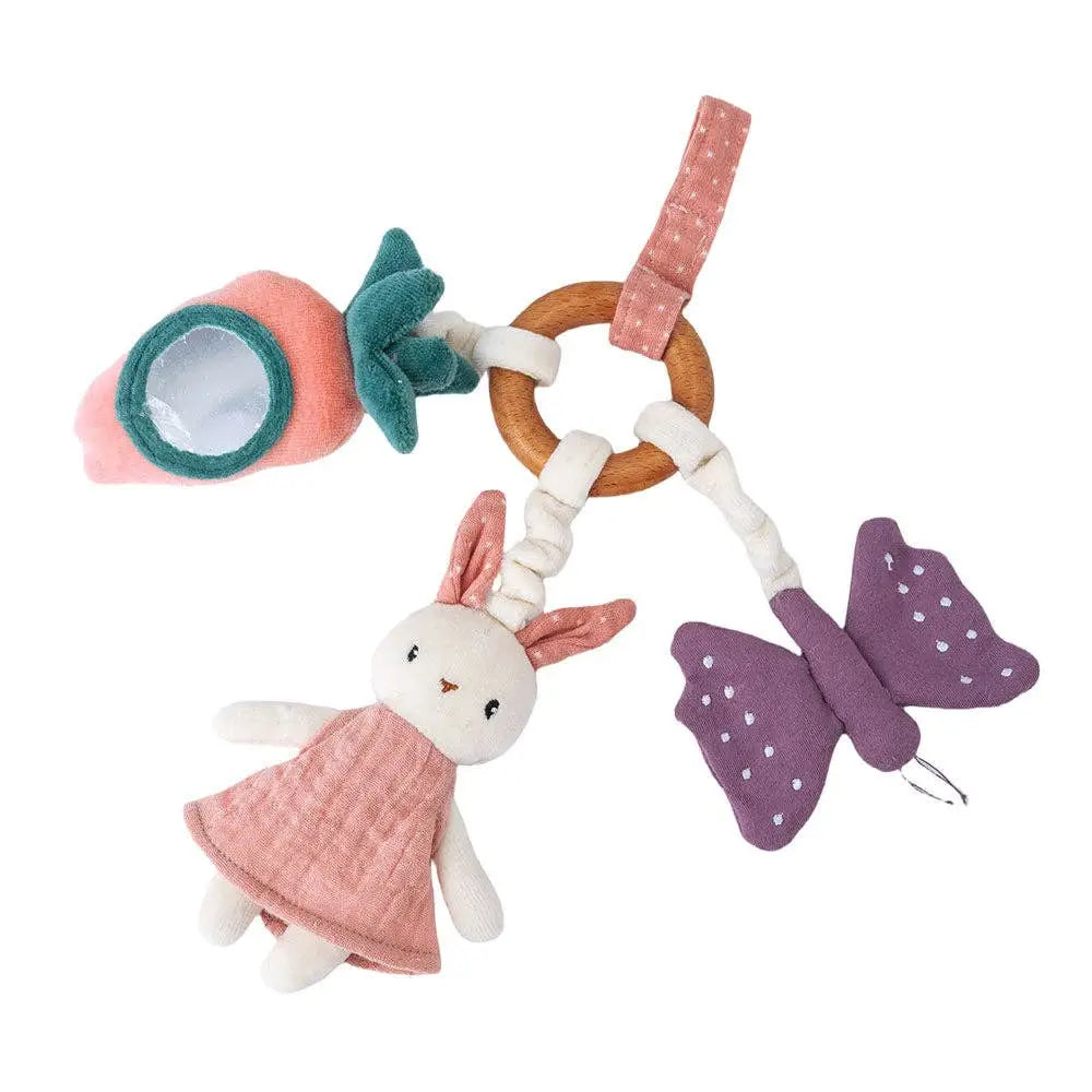 A soft baby sensory toy set featuring a plush bunny in a pink dress, a purple butterfly with white dots, a strawberry-shaped mirror, and a wooden ring, all attached to a pink polka-dot strap on a white background.