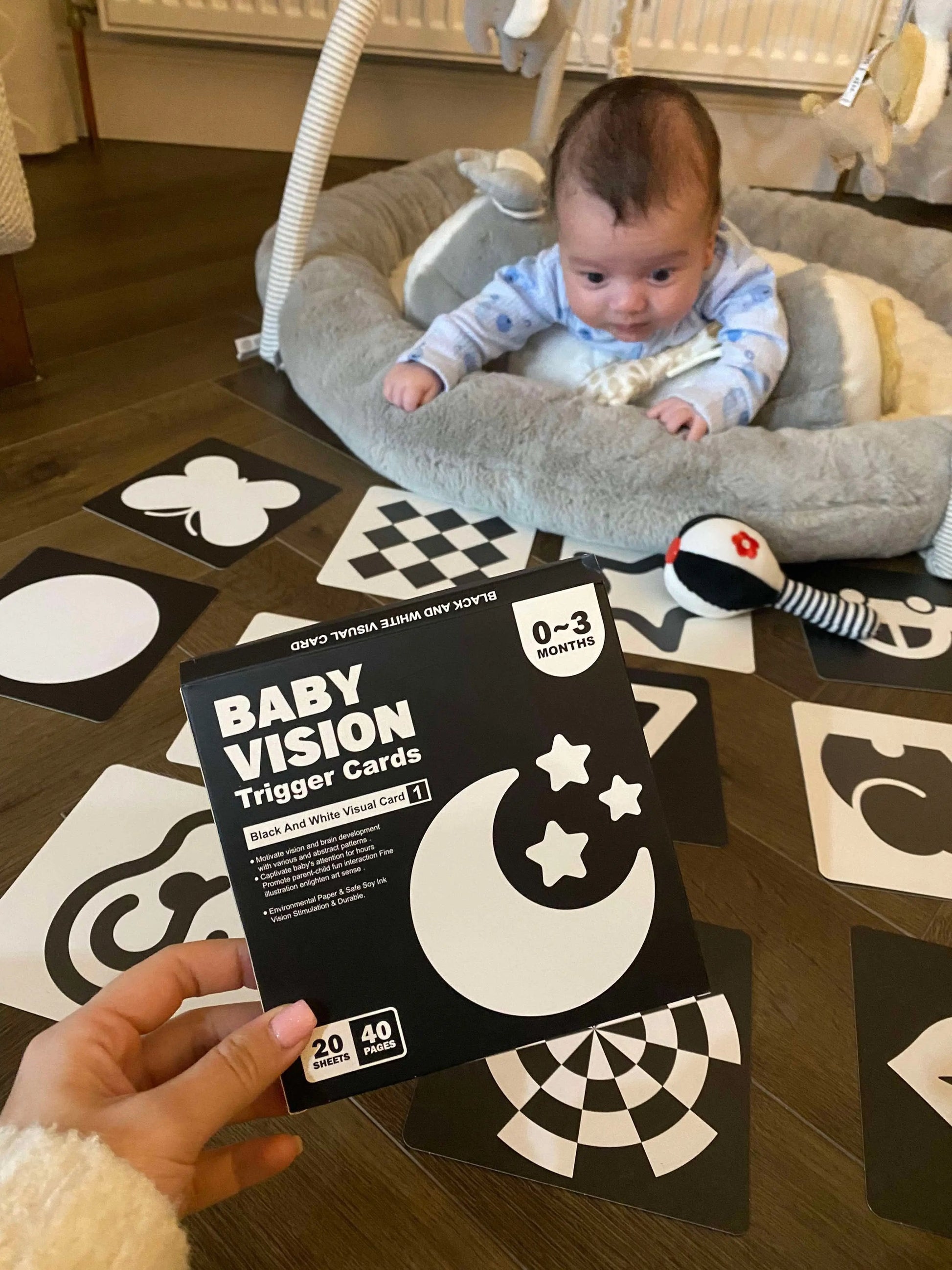 Baby playing with sensory flash cards