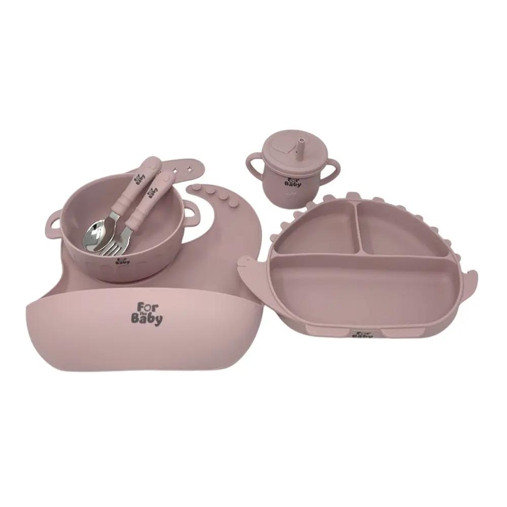 Pink silicone feeding set with suction plate, bowl, sippy cup, fork, spoon, and bib
