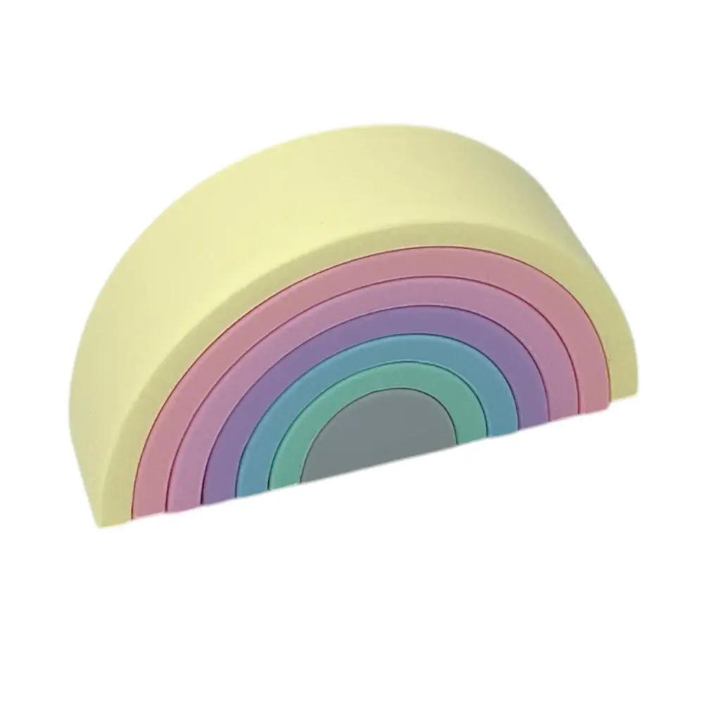 Pastel silicone rainbow stacking toy for infants and toddlers.