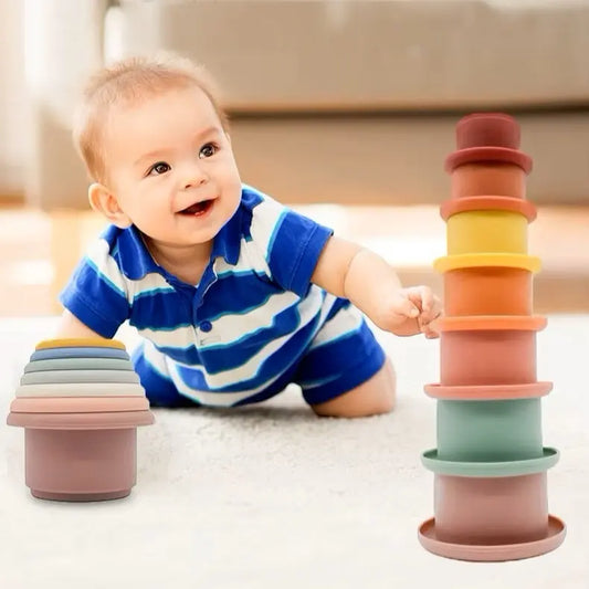 Baby playing with silicone stacking cup toy