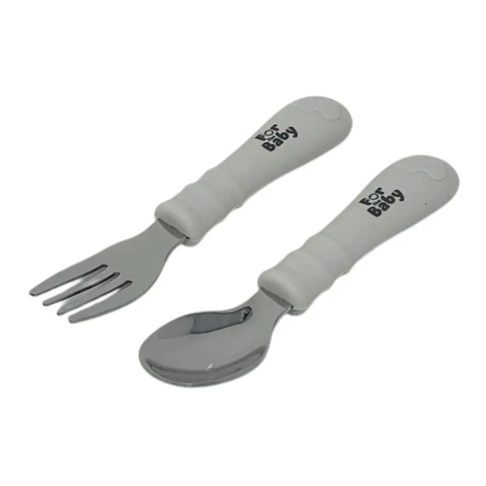 Toddler stainless steel fork and spoon set with soft silicone handles, designed for easy grip and independent eating.