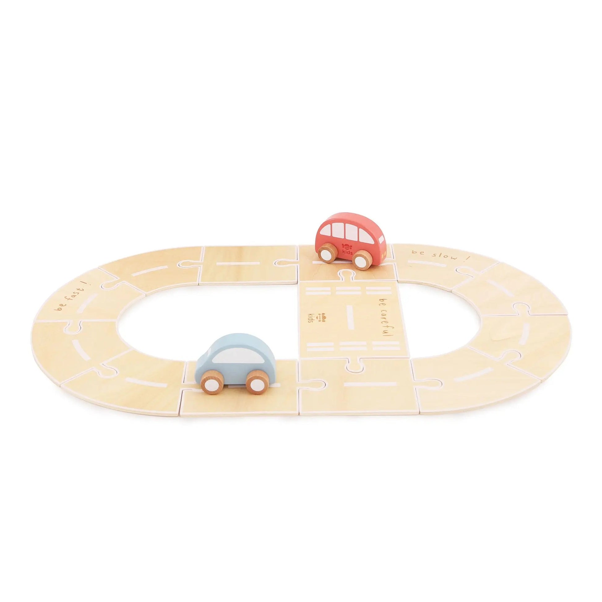 Wooden toy track with two cars on a white background