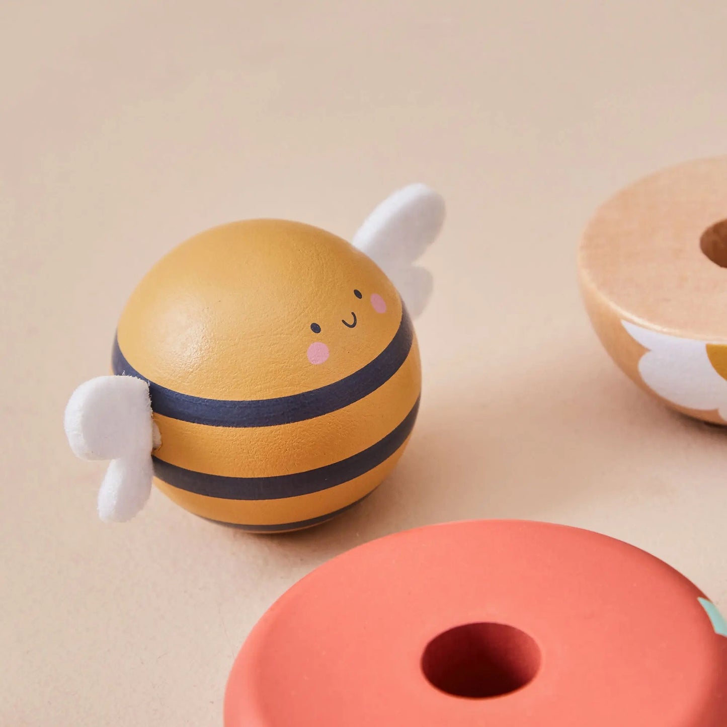 Toy bee with striped body from a stacking set