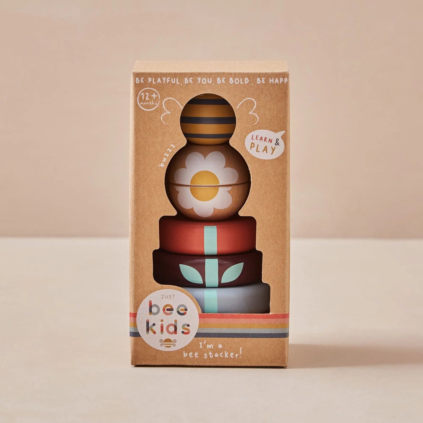 Stack of colourful wooden toys in a Just Bee Kids packaging