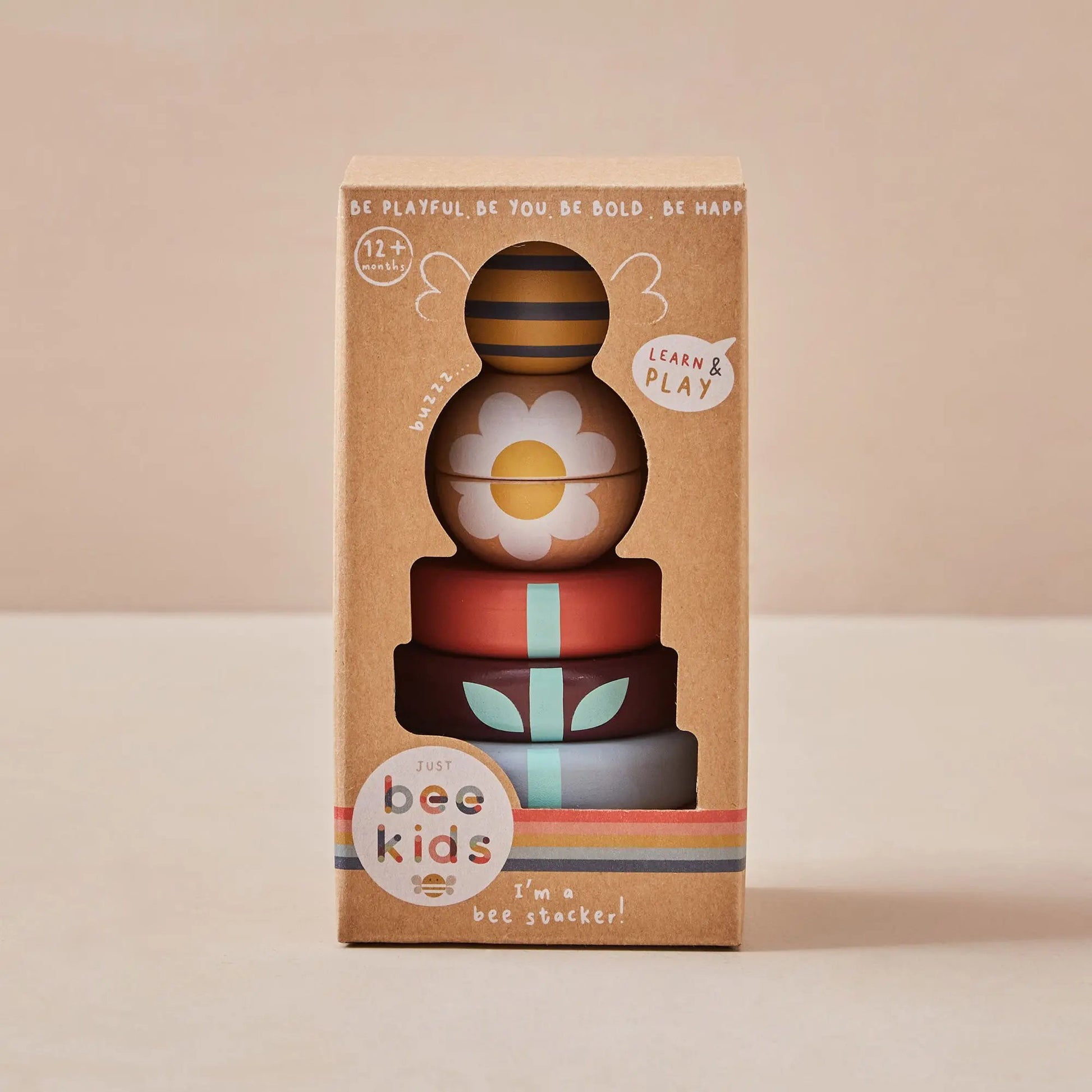 Stack of colourful wooden toys in a Just Bee Kids packaging