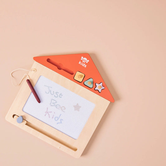 Children's drawing board with writing on a beige background