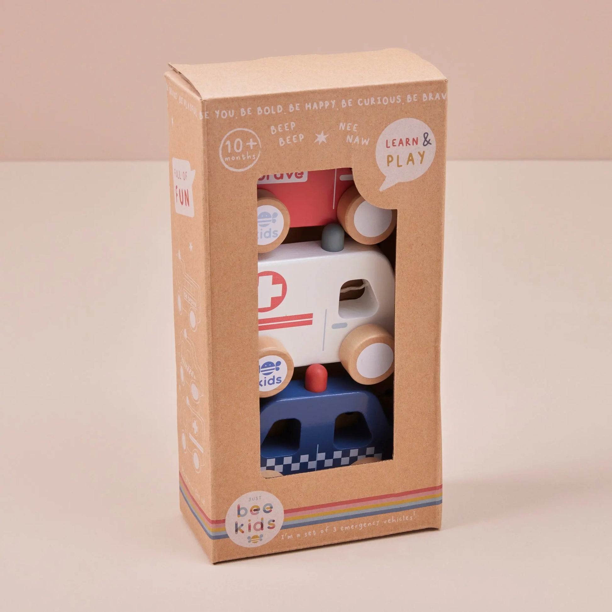 Toy truck packaging with 'just bee kids' branding on a beige background