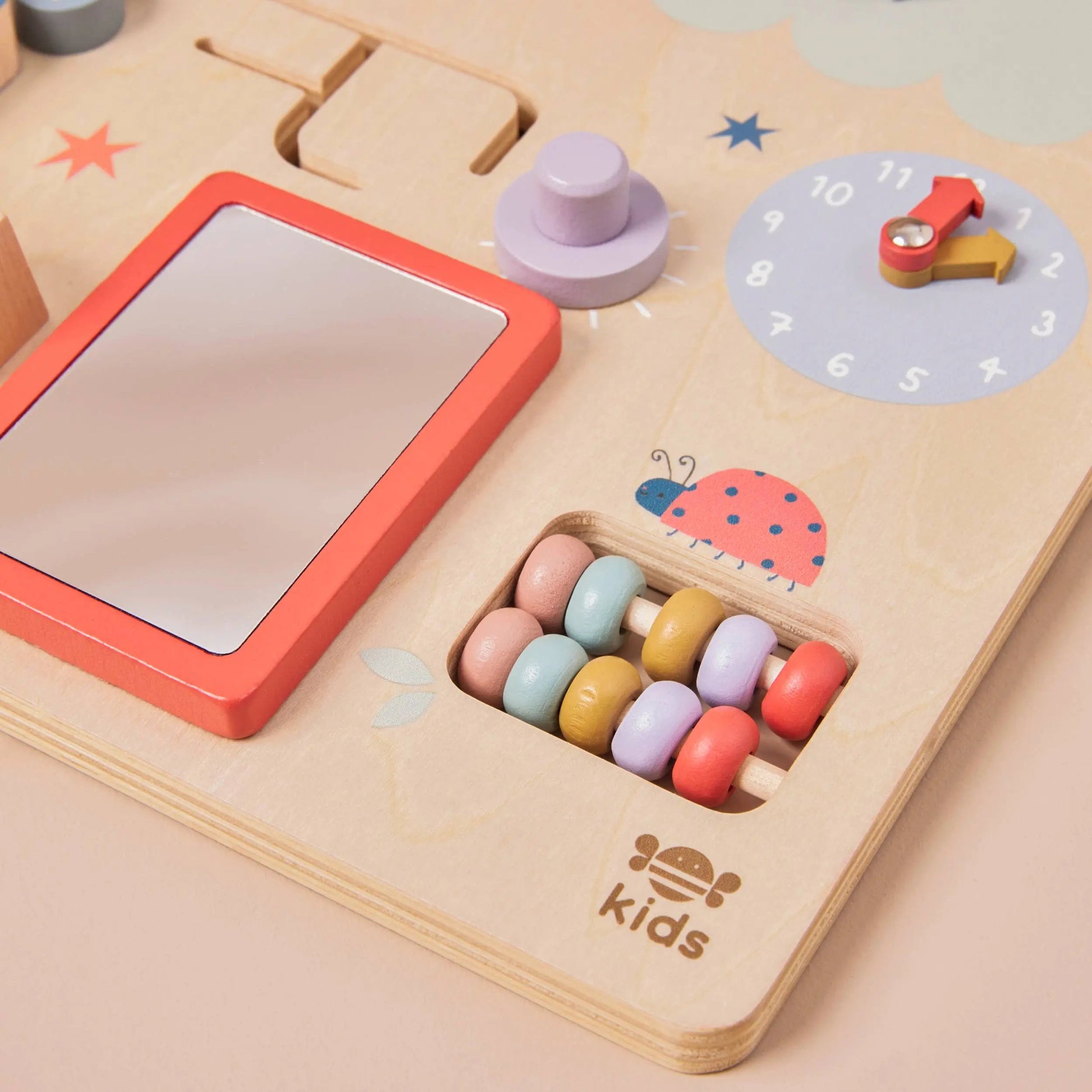 Wooden Busy Board close up of beads and mirror