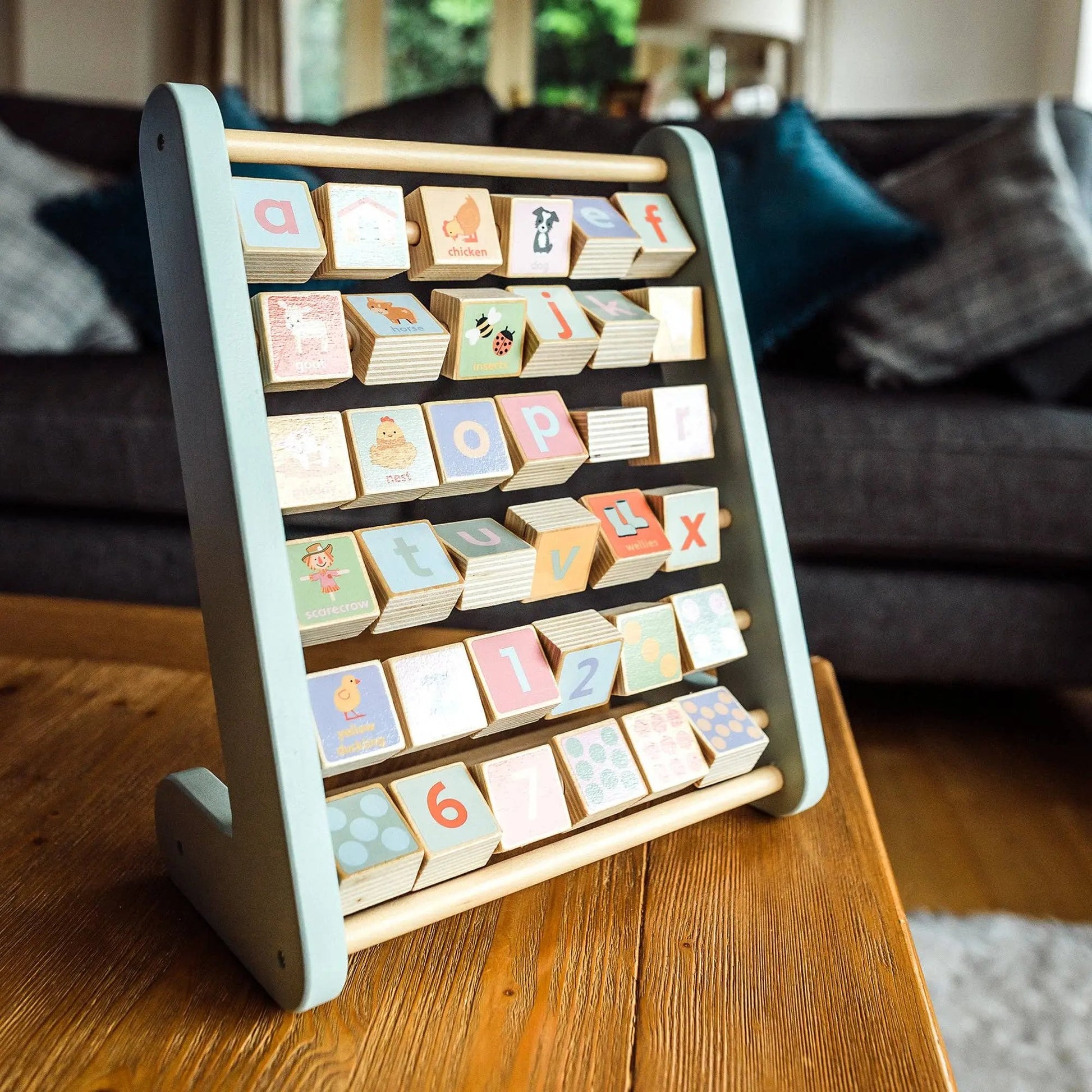 Farm Animal Wooden Alphabet Abacus sat on a table