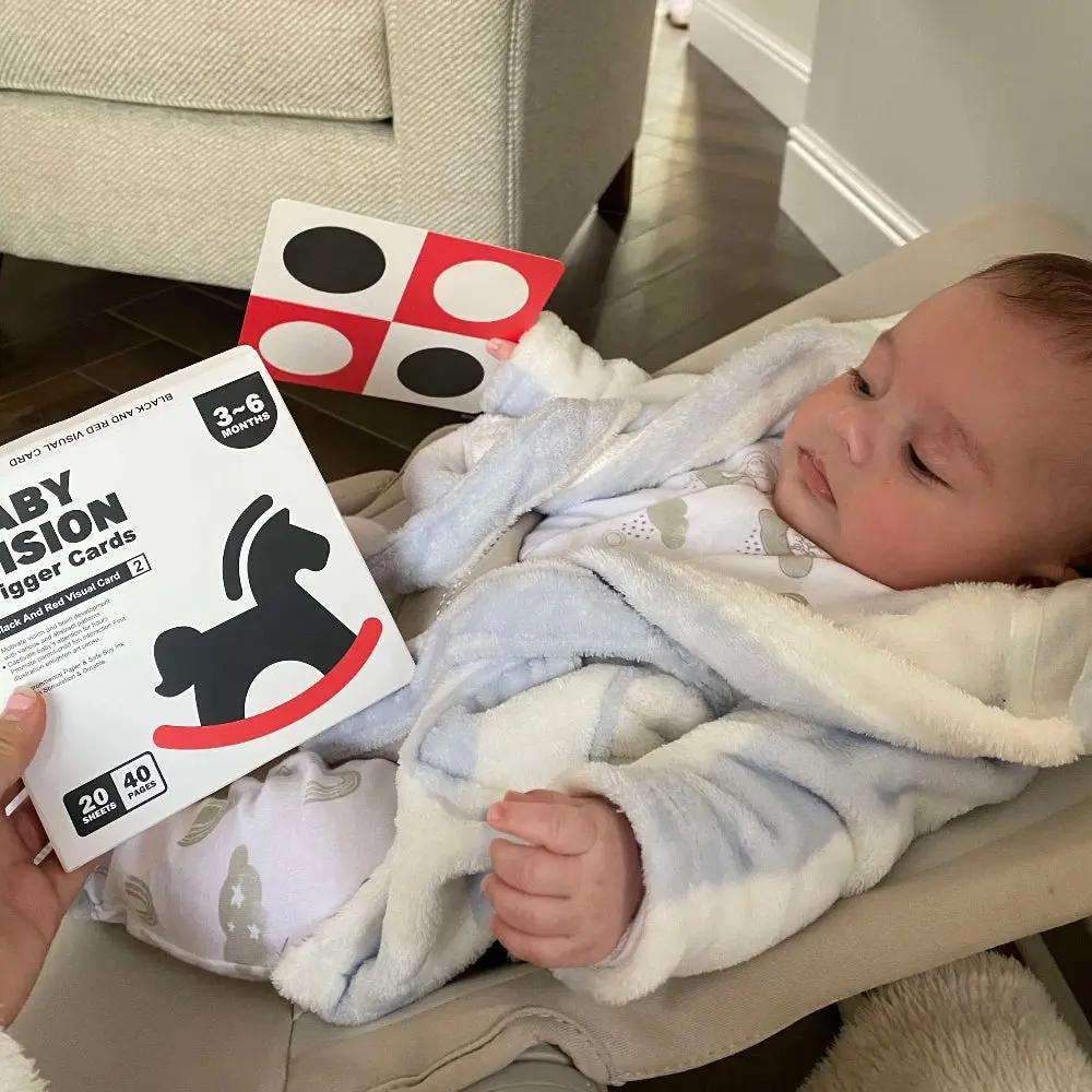 baby playing with flash cards