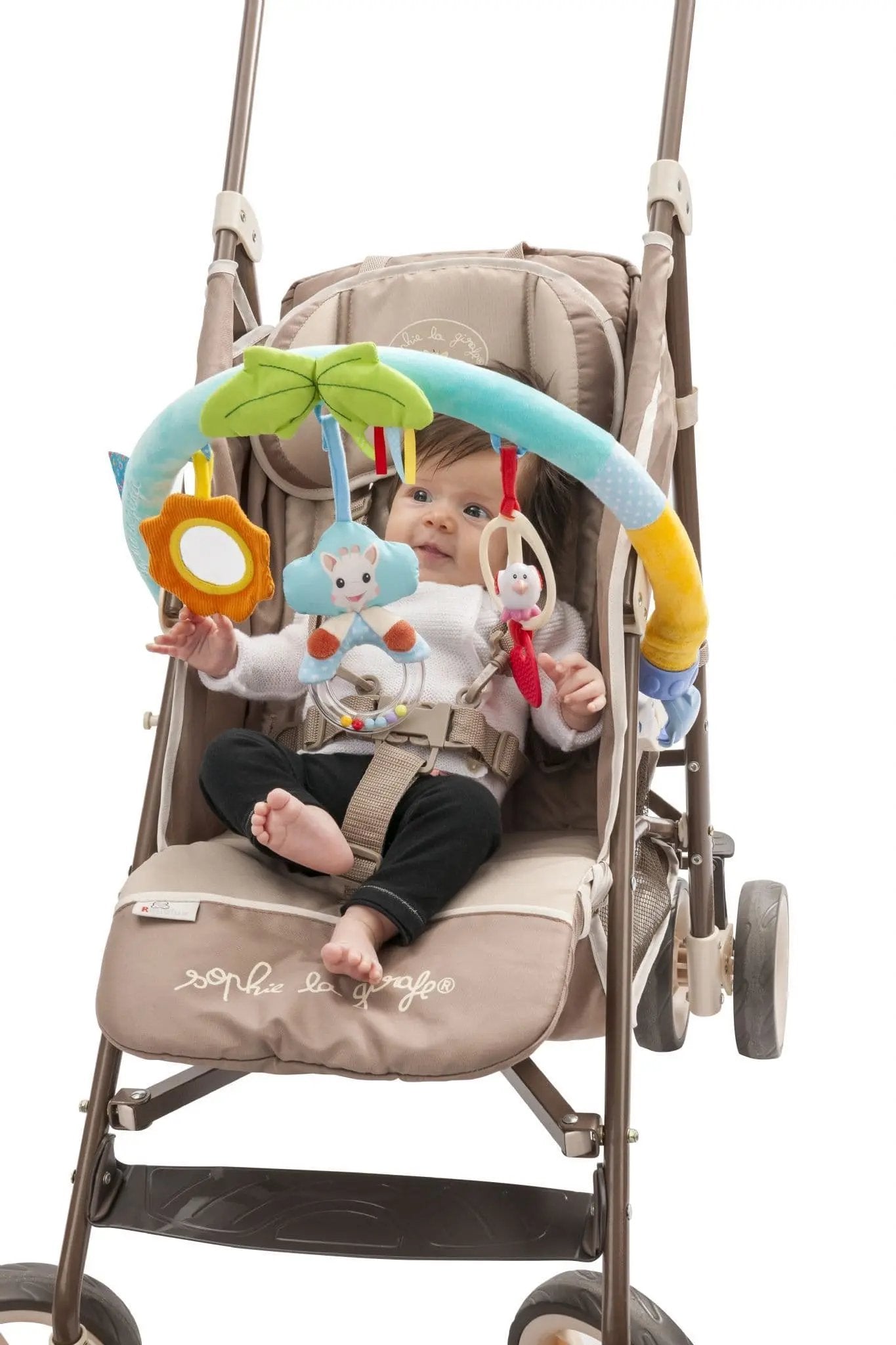 Baby interacting with the Sophie la Girafe Activity Arch