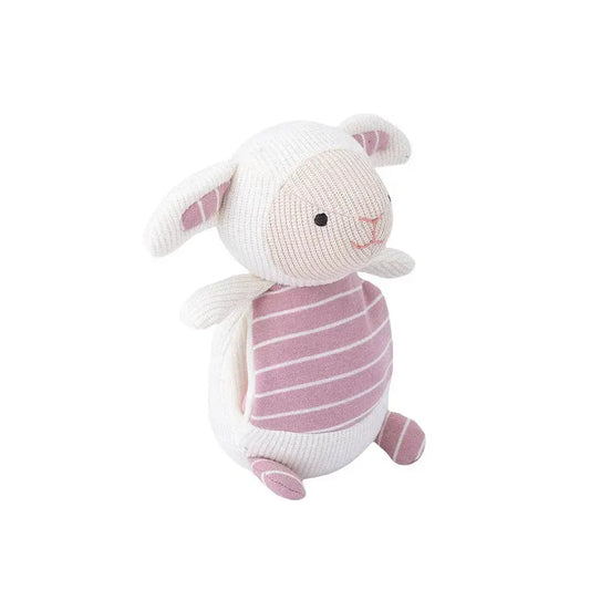 White and pink stuffed lamb toy on a white background