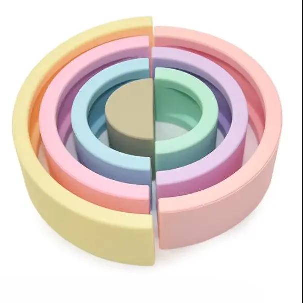 BPA-free, non-toxic silicone stacking toy for babies.
