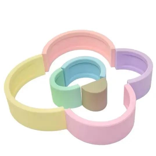 Dishwasher-safe silicone stacking toy in bright and pastel colors.