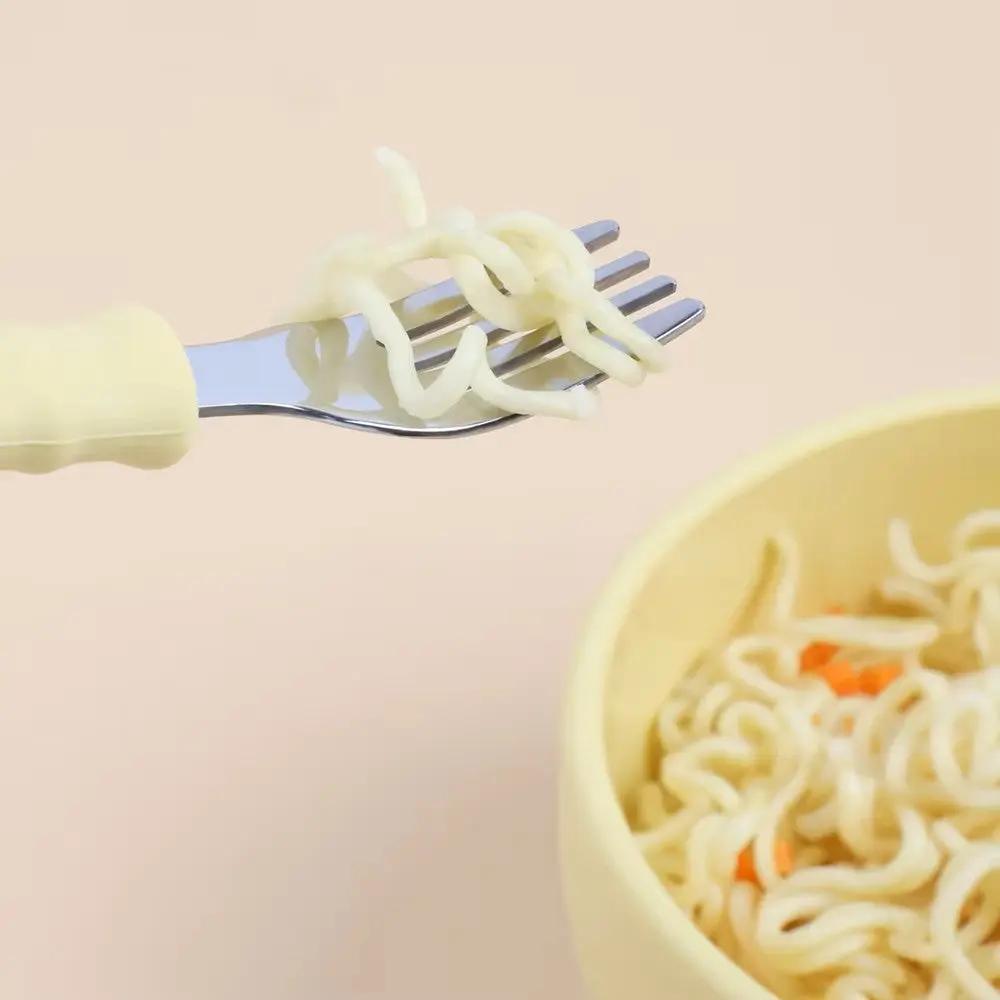 Gift-ready stainless steel and silicone baby cutlery set, ideal for mealtime training.