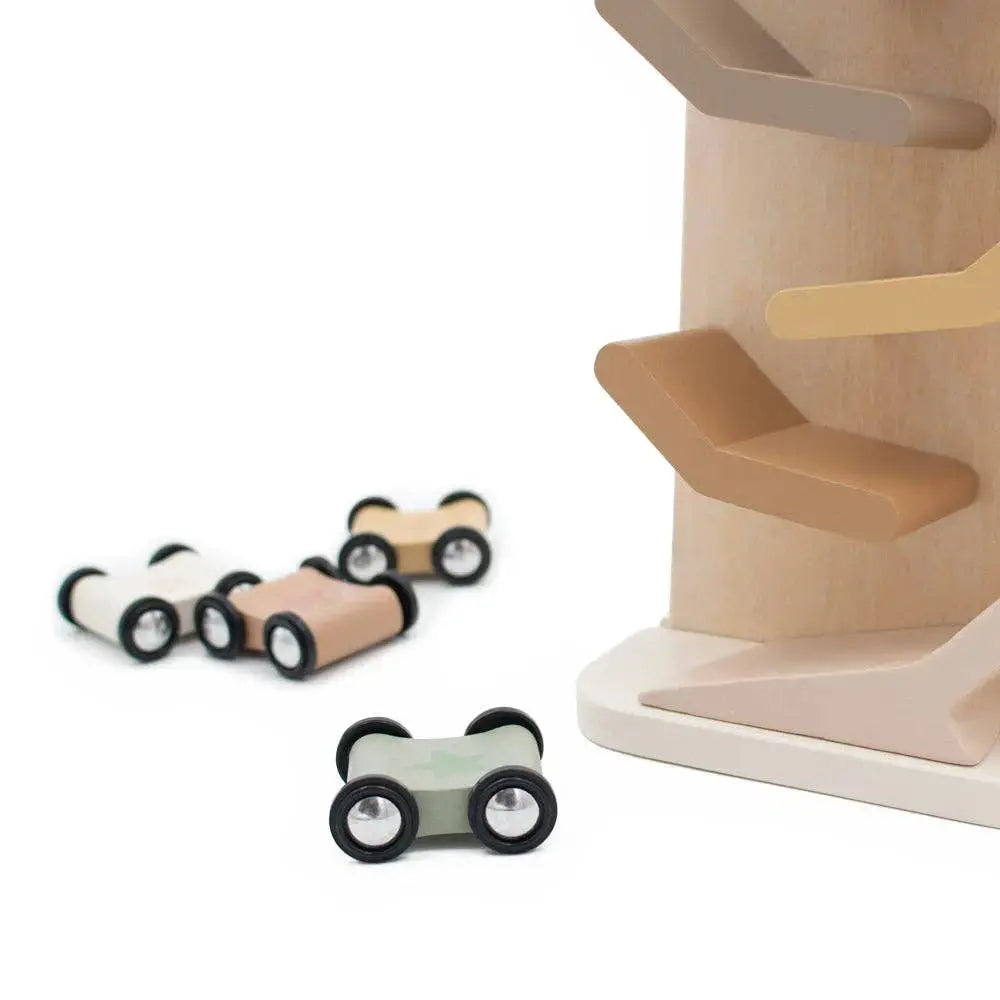Wooden toy cars and a spiral wooden track on a white background