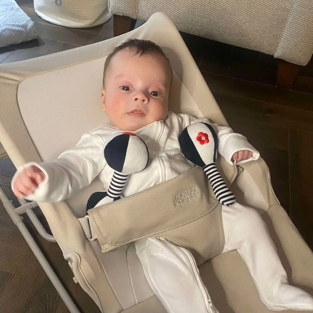 Baby with black & white rattles