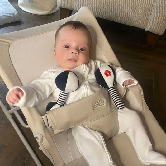 Baby with black & white rattles