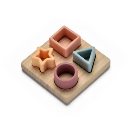 Set of colourful wooden shape sorting toys on a white background