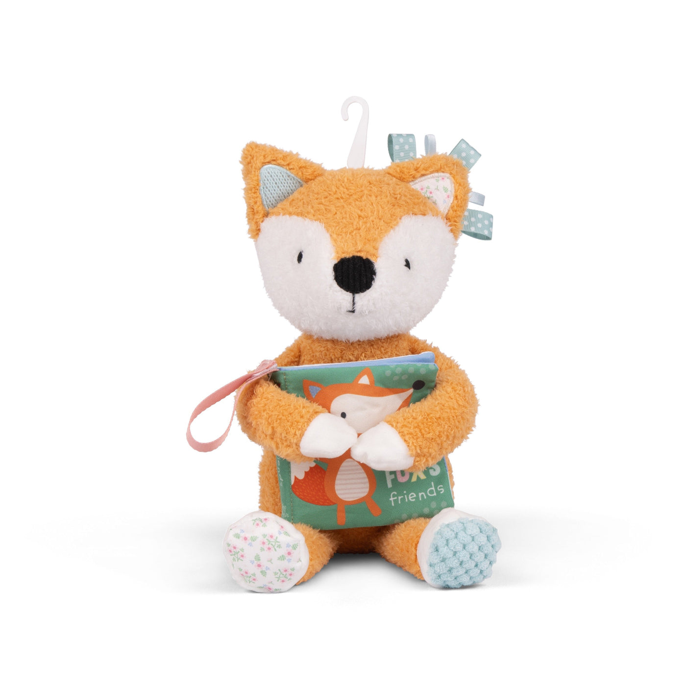 Plush fox toy holding a book