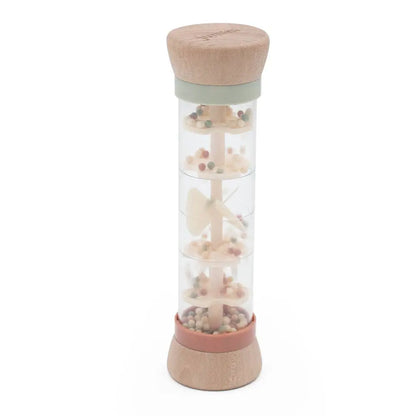 Rain maker toy with natural elements on a white background