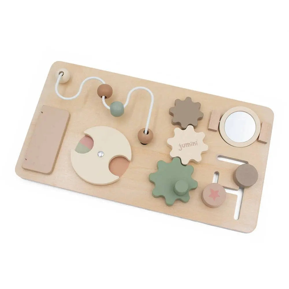 Wooden busy board toy with various shapes and textures on a white background