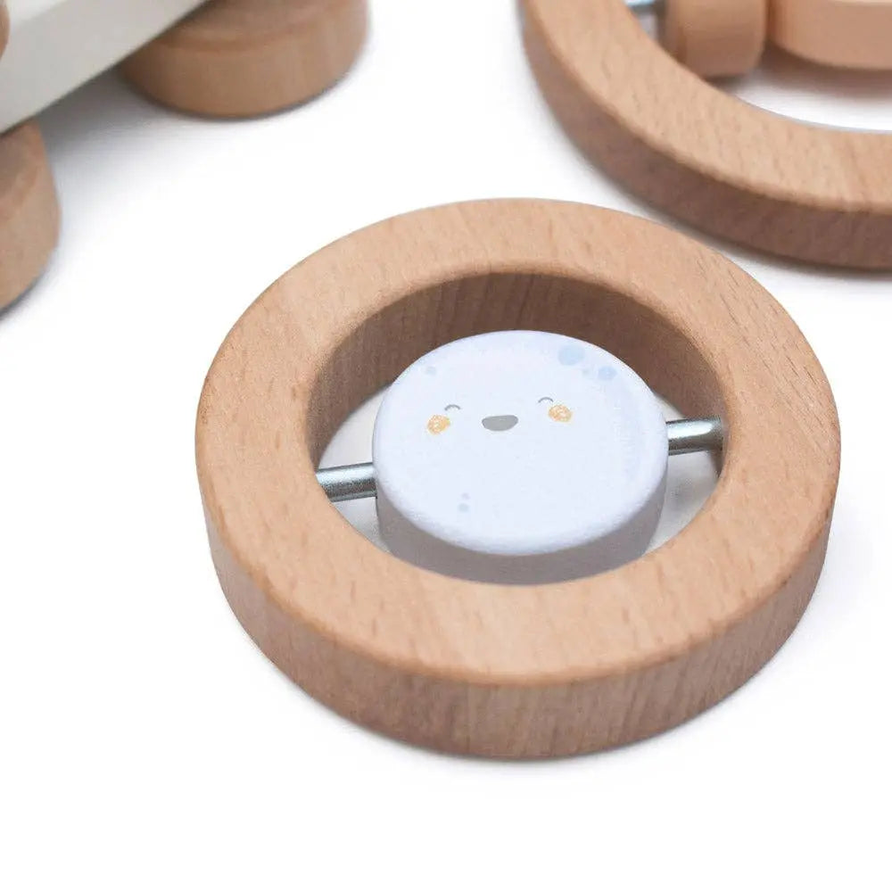 Wooden toy with a round white character inside on a white background