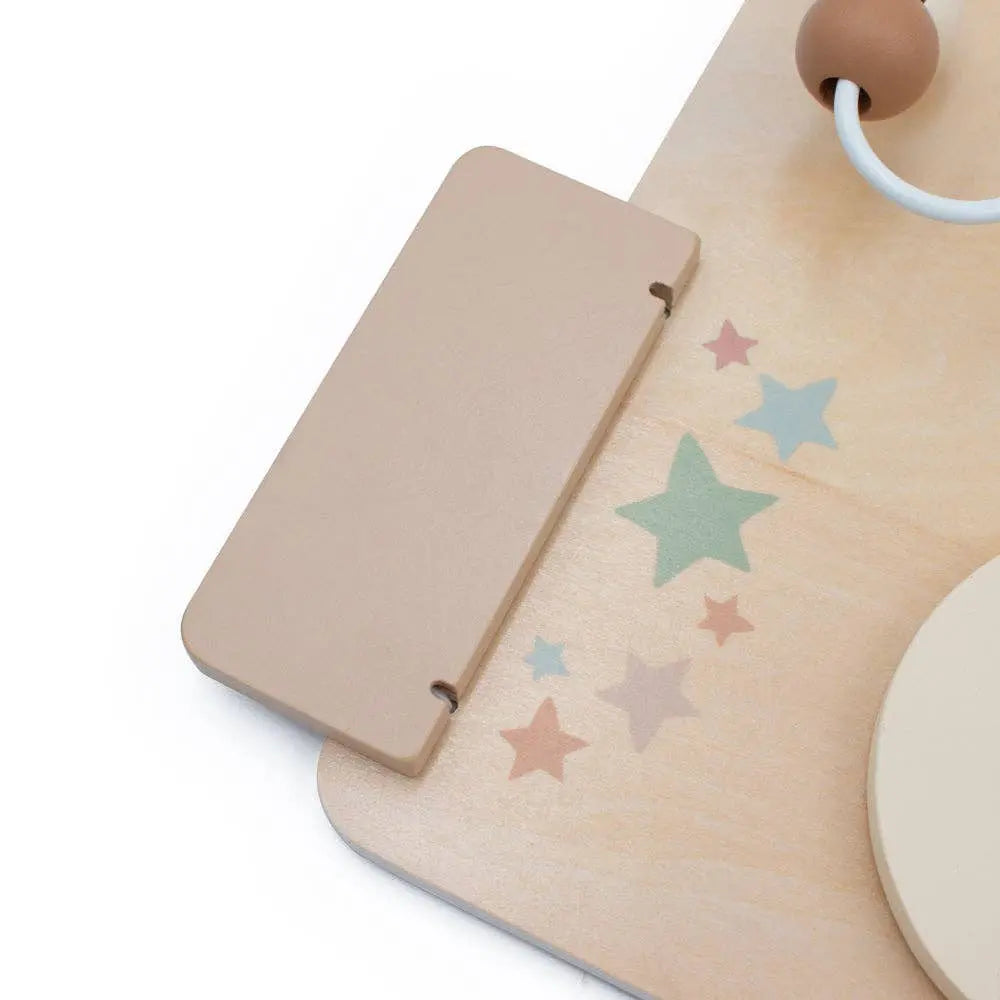 Wooden toy with star patterns on a white background
