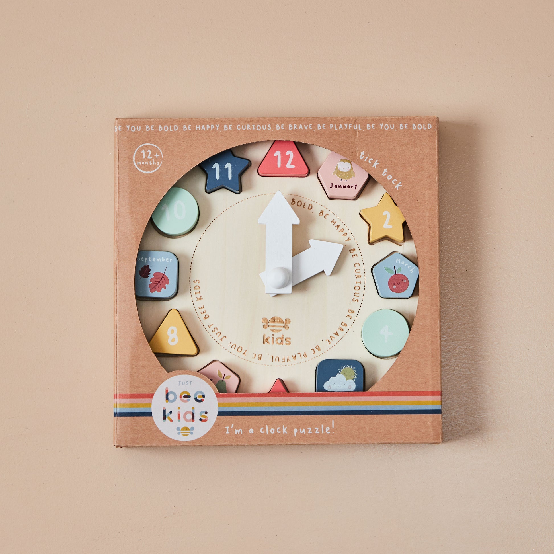 Wooden clock puzzle toy with colourful shapes in a 'just bee kids' branded box on a beige background