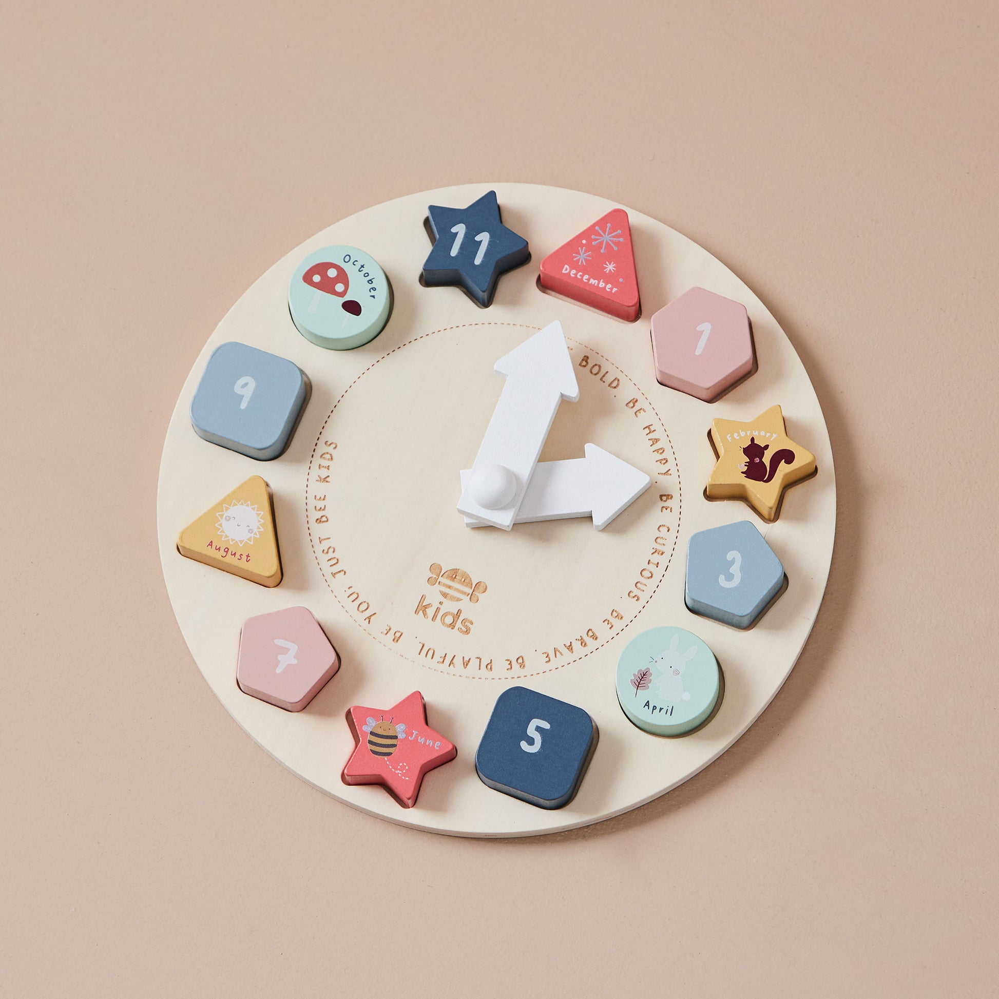 Wooden educational clock toy with colourful shapes and numbers on a beige background