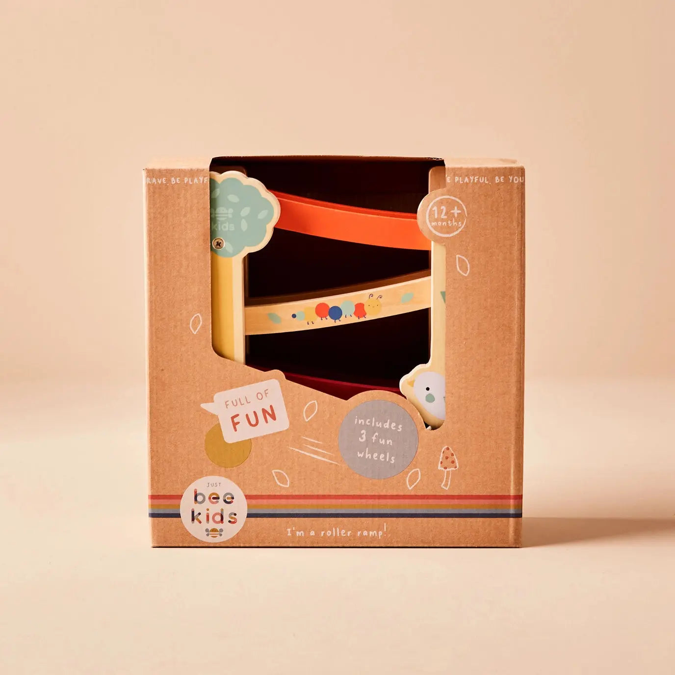 Box packaging for a children's roller toy with 'just bee kids' branding on a beige background