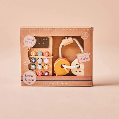 Wooden toy set in packaging with 'just bee kids' branding on a beige background