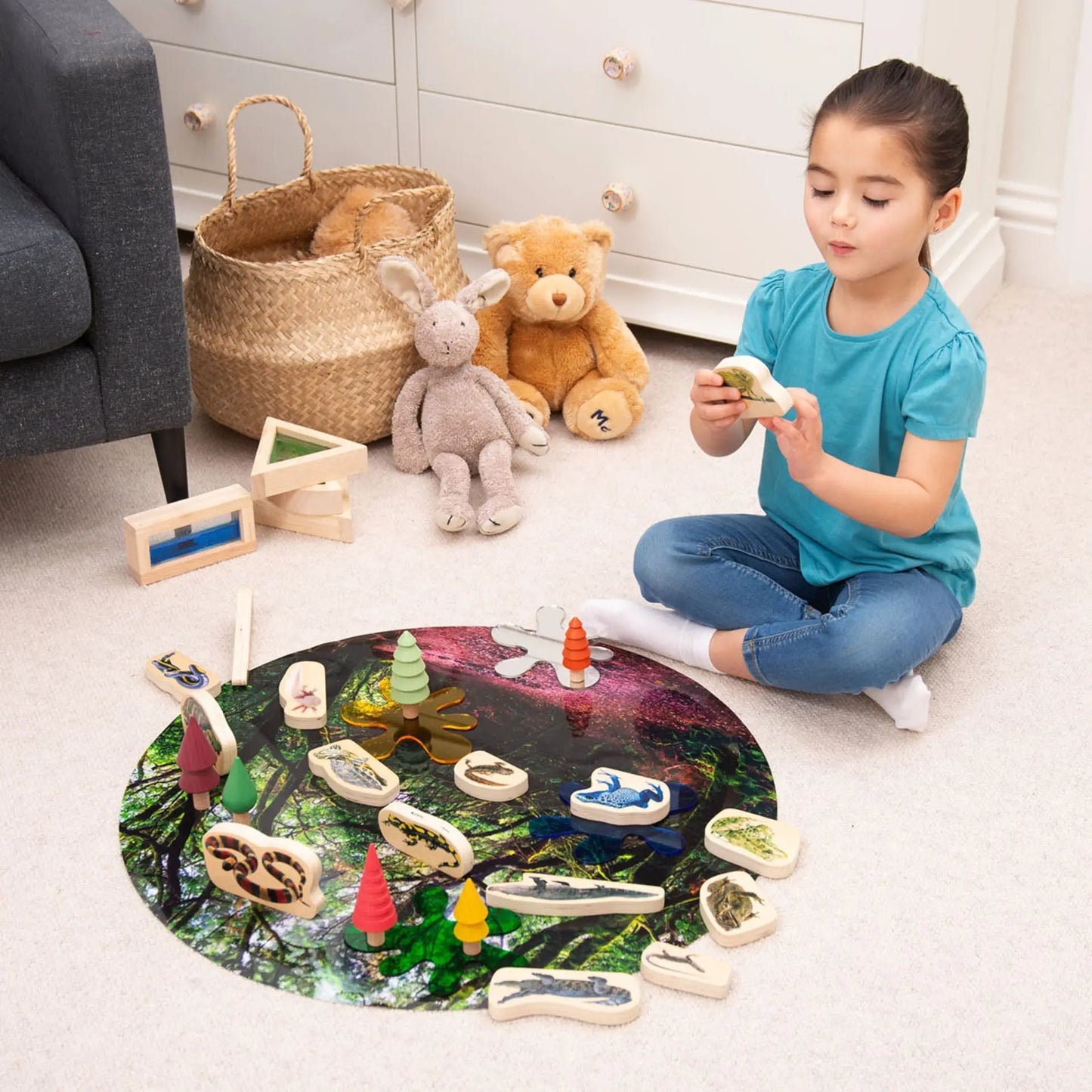 Child playing with a wooden toy set on the floor in a home setting.