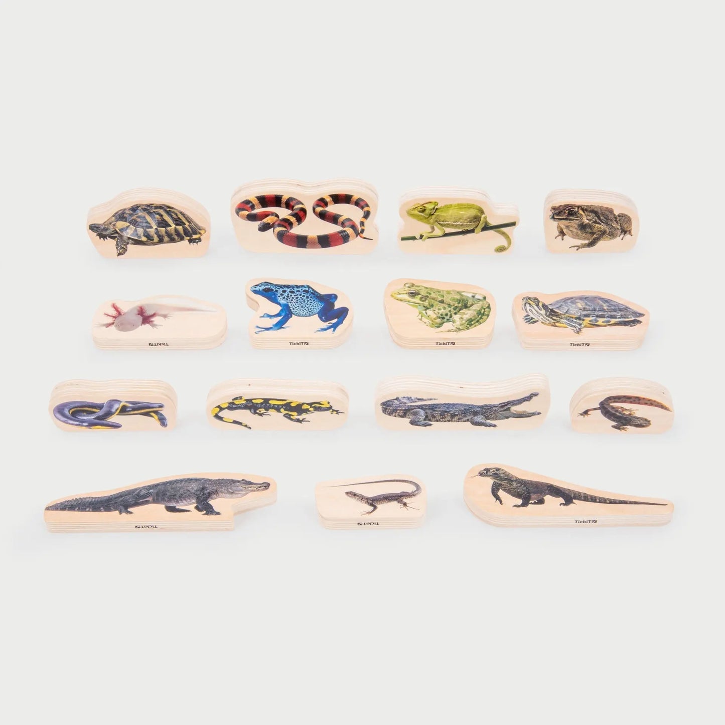 Set of wooden animal figures on a white background