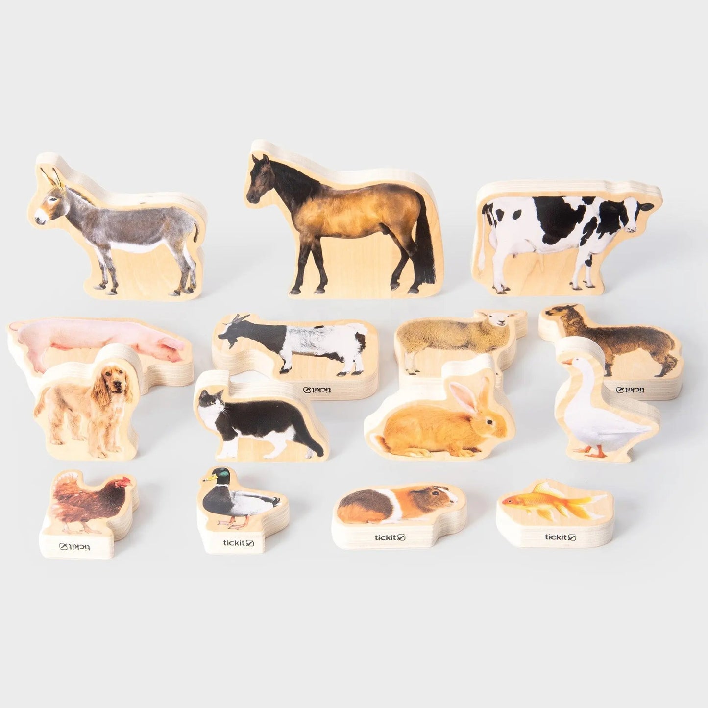Set of animal-shaped wooden toys on a white background