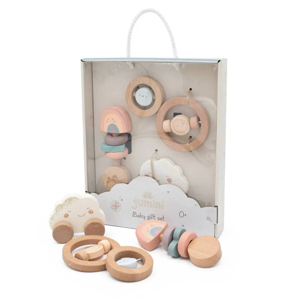 Set of wooden baby toys with packaging on a white background