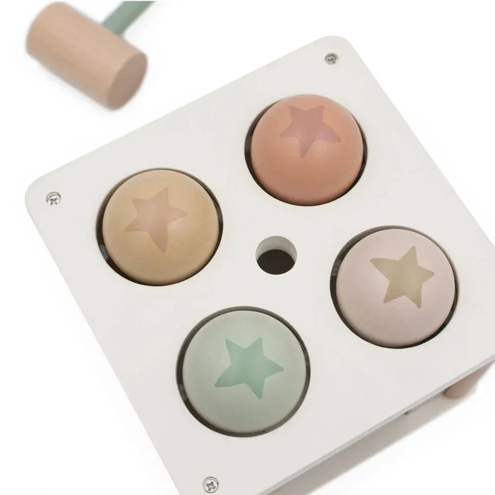 Pounding box with four star-shaped coloured balls on a white background