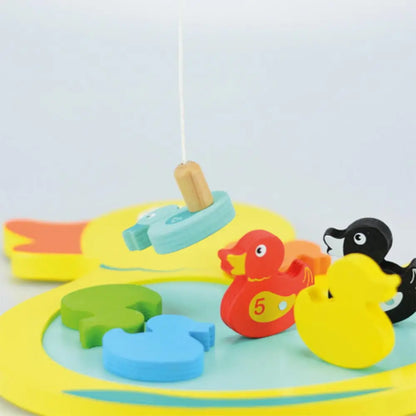 Colourful wooden duck hook game with duck toys on a light blue background